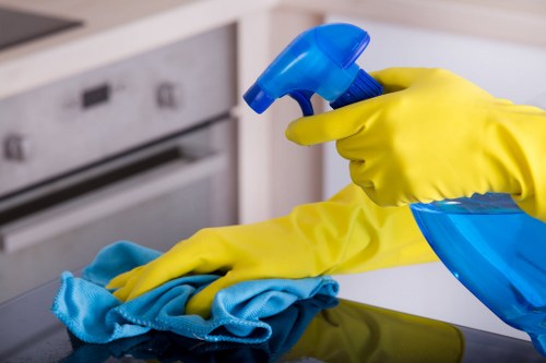 Cleaning specialist treating sofa stains in Kennington